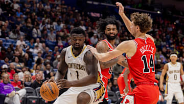 Nov 24, 2025; New Orleans, Louisiana, USA;  New Orleans Pelicans forward Zion Williamson (1) dribbles against Chicago Bulls forward Matas Buzelis (14) during the first half at Smoothie King Center. Mandatory Credit: Stephen Lew-Imagn Images