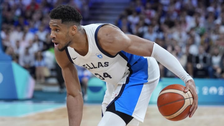 Jul 27, 2024; Villeneuve-d'Ascq, France; Greece small forward Giannis Antetokounmpo (34) controls the ball against Canada in the second half during the Paris 2024 Olympic Summer Games at Stade Pierre-Mauroy. Mandatory Credit: John David Mercer-USA TODAY Sports