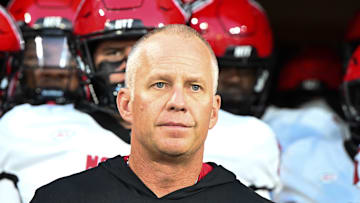 Sep 11, 2025; Winston-Salem, North Carolina, USA;  North Carolina State Wolfpack head coach Dave Doeren walks his team out on the field against the Wake Forest Demon Deacons at Allegacy Federal Credit Union Stadium. Mandatory Credit: Luke Jamroz-Imagn Images