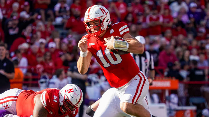 Oct 21, 2023; Lincoln, Nebraska, USA; Nebraska Cornhuskers quarterback Heinrich Haarberg (10) runs the ball against the Northwestern Wildcats during the second quarter at Memorial Stadium. 