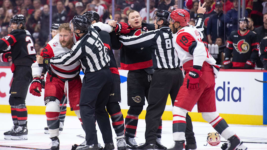 Apr 25, 2026; Ottawa, Ontario, CAN; Tensions rise as Carolina Hurricanes left wing Nicolas Deslauriers (44) fights with Ottawa Senators left wing Brady Tkachuk (7) in the second period of game four of the first round of the 2026 Stanley Cup Playoffs at the Canadian Tire Centre. Mandatory Credit: Marc DesRosiers-Imagn