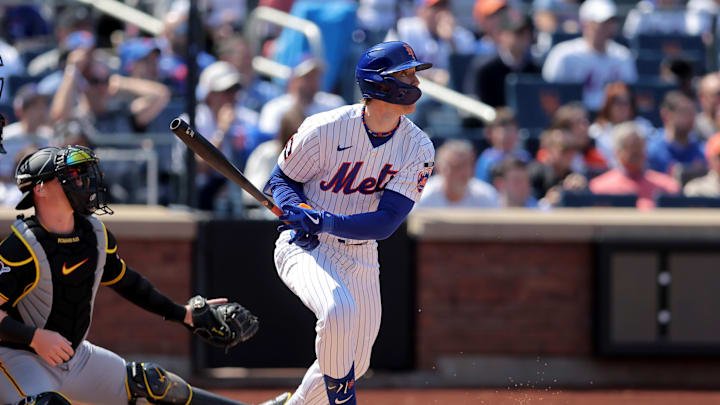 Mar 26, 2026; New York City, New York, USA; New York Mets designated hitter Brett Baty (7) watches his three run triple against the Pittsburgh Pirates during the first inning at Citi Field. Mandatory Credit: Brad Penner-Imagn Images