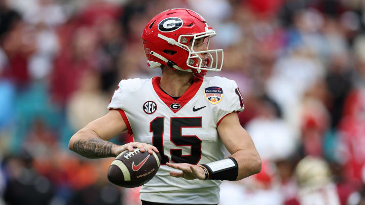 Dec 30, 2023; Miami Gardens, FL, USA; Georgia Bulldogs quarterback Carson Beck (15) drops back to pass against the Florida State Seminoles during the first half in the 2023 Orange Bowl at Hard Rock Stadium. Mandatory Credit: Nathan Ray Seebeck-USA TODAY Sports