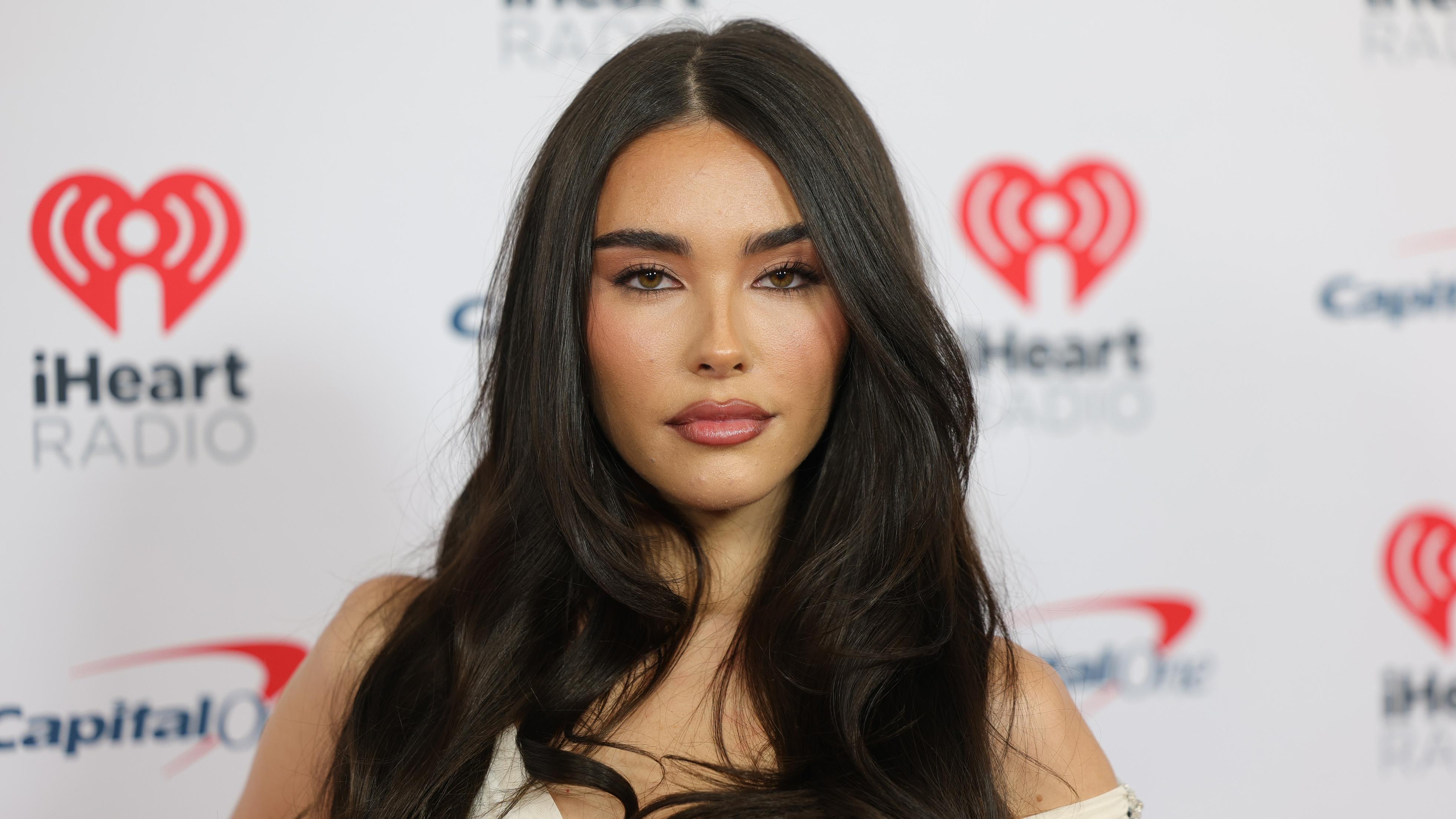 Madison Beer Is a Sultry Wintertime Vision in Black and White Plunging Lace  Gown