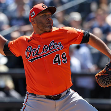 Mar 11, 2025; Tampa, Florida, USA; Baltimore Orioles pitcher Albert Suarez (49) throws a pitch against the New York Yankees in the second inning during spring training at George M. Steinbrenner Field.