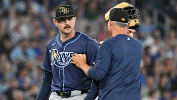 May 17, 2024; Toronto, Ontario, CAN;  Tampa Bay Rays pitcher Tyler Alexander (14) is relieved by manager Kevin Cash (16) in the eighth inning against the Toronto Blue Jays at Rogers Centre. Mandatory Credit: Dan Hamilton-Imagn Images