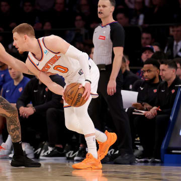 Mar 25, 2024; New York, New York, USA; New York Knicks guard Donte DiVincenzo (0) controls the ball against Detroit Pistons guard Evan Fournier (31) during the fourth quarter at Madison Square Garden. Mandatory Credit: Brad Penner-USA TODAY Sports