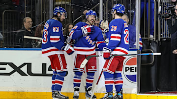 Feb 2, 2025; New York, New York, USA; New York Rangers center Mika Zibanejad (93) celebrates with center Vincent Trocheck (16) and left wing Chris Kreider (20) after a 4-2 victory against the Vegas Golden Knights at Madison Square Garden. Mandatory Credit: Danny Wild-Imagn Images
