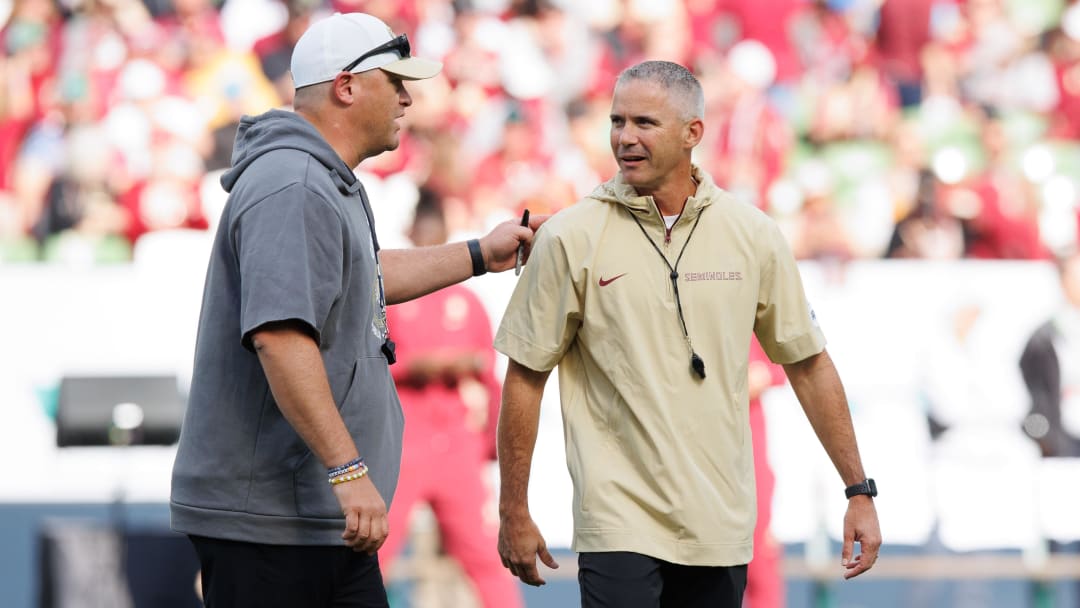 Aug 24, 2024; Dublin, IRL; Georgia Tech head coach Brent Key and Florida State University head coach Mike Norvell before the game at Aviva Stadium. Mandatory Credit: Tom Maher/INPHO via USA TODAY Sports