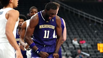 Nov 17, 2023; Las Vegas, Nevada, USA; Washington Huskies center Franck Kepnang (11) reacts after blocking a shot against Xavier. Mandatory Credit: Stephen R. Sylvanie-Imagn Images