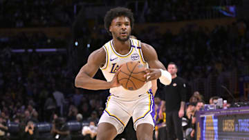 Dec 8, 2024; Los Angeles, California, USA;  Los Angeles Lakers guard Bronny James (9) handles the ball in the second half against the Portland Trail Blazers at Crypto.com Arena. Mandatory Credit: Jayne Kamin-Oncea-Imagn Images
