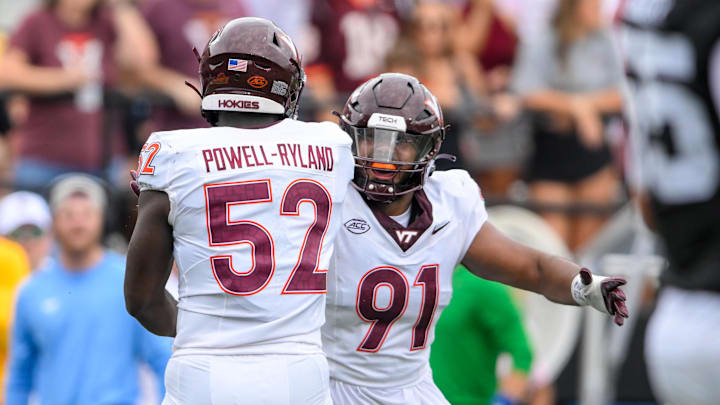 Aug 31, 2024; Nashville, Tennessee, USA;  Virginia Tech Hokies defensive lineman Wilfried Pene (91) and Virginia Tech Hokies defensive lineman Antwaun Powell-Ryland (52) celebratione a sack against the Vanderbilt Commodores during the first half at FirstBank Stadium. Mandatory Credit: Steve Roberts-Imagn Images