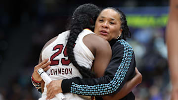 Apr 6, 2025; Tampa, FL, USA; South Carolina Gamecocks head coach Dawn Staley hugs guard Raven Johnson (25) during the second half of the national championship of the women's 2025 NCAA tournament at Amalie Arena. Mandatory Credit: Nathan Ray Seebeck-Imagn Images