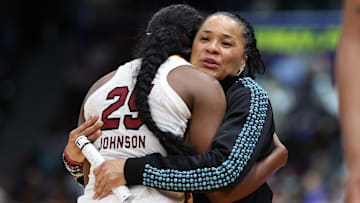 Apr 6, 2025; Tampa, FL, USA; South Carolina Gamecocks head coach Dawn Staley hugs guard Raven Johnson (25) during the second half of the national championship of the women's 2025 NCAA tournament at Amalie Arena. Mandatory Credit: Nathan Ray Seebeck-Imagn Images