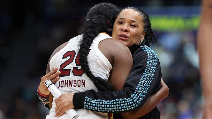 Apr 6, 2025; Tampa, FL, USA; South Carolina Gamecocks head coach Dawn Staley hugs guard Raven Johnson (25) during the second half of the national championship of the women's 2025 NCAA tournament at Amalie Arena. Mandatory Credit: Nathan Ray Seebeck-Imagn Images