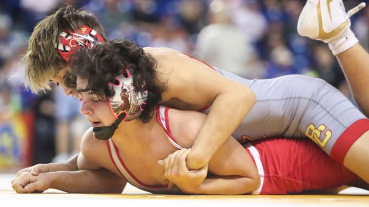 Smyrna (DE) wrestler Devin Smith (front) wrestles to a loss in a preliminary round at 120 pounds to Micah Loudermilk of Bergen Catholic (NJ) by technical fall in the Beast of the East tournament, Saturday, Dec. 21, 2024 at the Bob Carpenter Center at the University of Delaware.