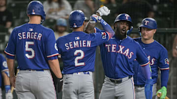 Apr 22, 2025; West Sacramento, California, USA; Texas Rangers second baseman Marcus Semien (2) celebrates with outfielder Adolis García (53) after hitting a home run against the Athletics during the fifth inning at Sutter Health Park. Mandatory Credit: Ed Szczepanski-Imagn Images
