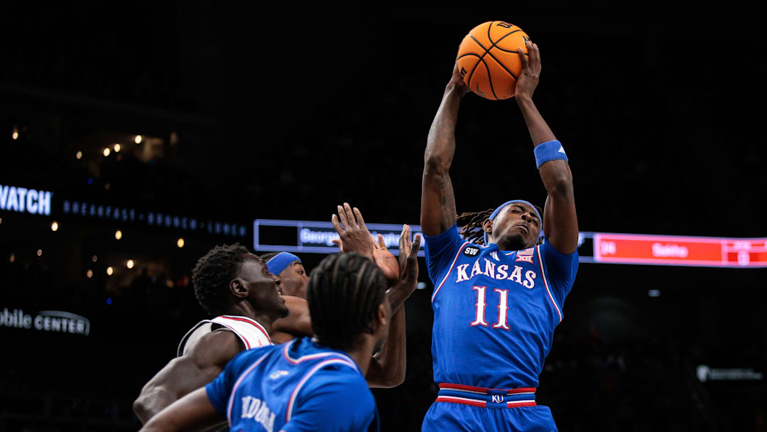 Mar 13, 2026; Kansas City, MO, USA; Kansas Jayhawks guard Jamari McDowell (11) rebounds during the first half against the Houston Cougars at T-Mobile Center. Mandatory Credit: William Purnell-Imagn Images