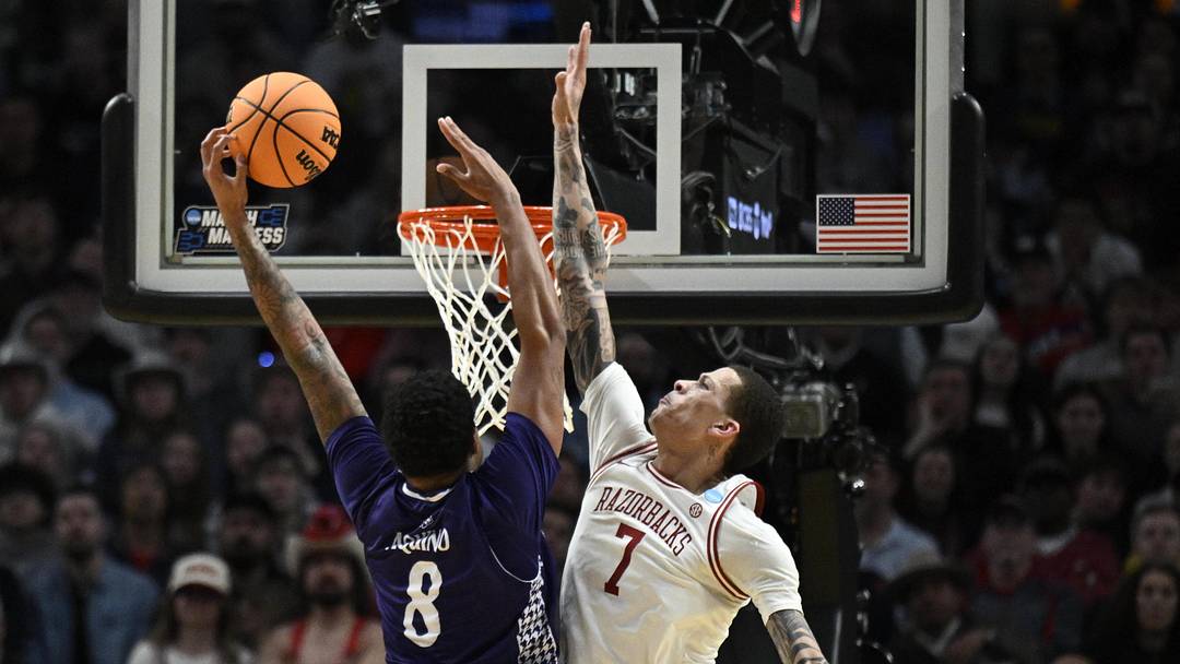 Mar 21, 2026; Portland, OR, USA; High Point Panthers forward Owen Aquino (8) shoots against Arkansas Razorbacks forward Trevon Brazile (7) in the second half during a second round game of the men's 2026 NCAA Tournament at Moda Center. Mandatory Credit: Troy Wayrynen-Imagn Images Mar 21, 2026; Portland, OR, USA; High Point Panthers forward Owen Aquino (8) shoots against Arkansas Razorbacks forward Trevon Brazile (7) in the second half during a second round game of the men's 2026 NCAA Tournament at Moda Center. Mandatory Credit: Troy Wayrynen-Imagn Images