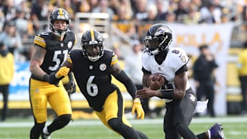 Nov 17, 2024; Pittsburgh, Pennsylvania, USA;  Baltimore Ravens quarterback Lamar Jackson (8) runs the ball against Pittsburgh Steelers linebacker Patrick Queen (6) during the first quarter at Acrisure Stadium. Mandatory Credit: Charles LeClaire-Imagn Images
