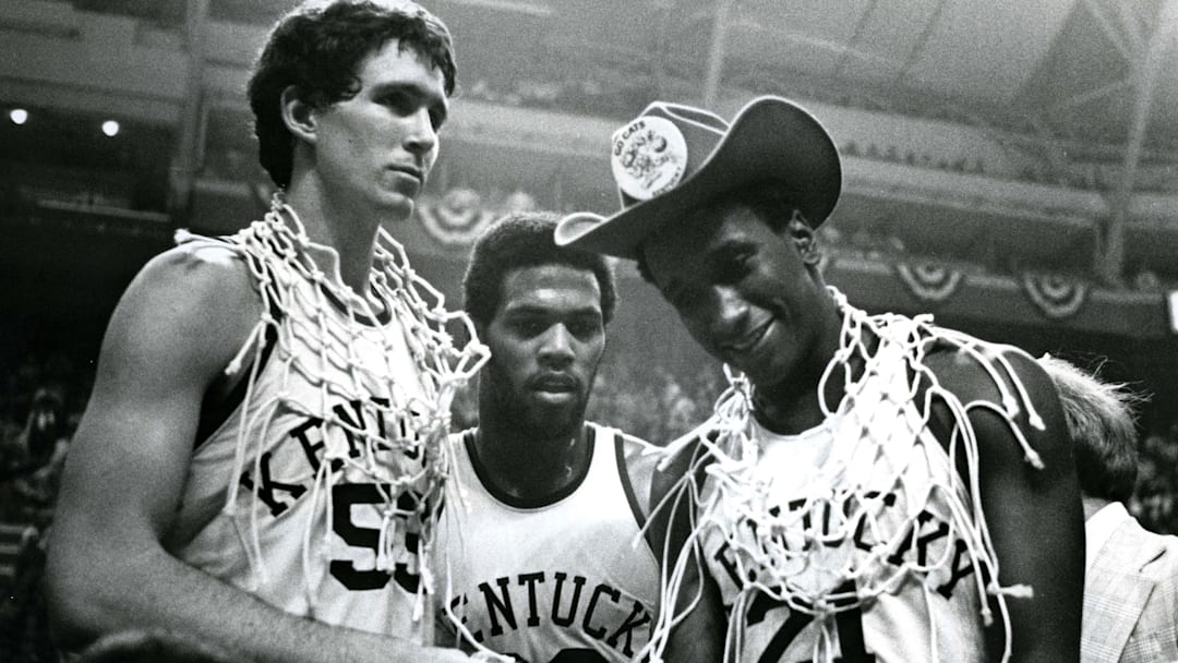 March 27, 1978; St. Louis, MO, USA; FILE PHOTO; Kentucky Wildcats center Rick Robey (53) guard James Lee (32) and Jack Givens (21) celebrate a victory over the Duke Blue Devils during the championship game for the 1978 NCAA men basketball tournament. Kentucky beat Duke 94-88. Mandatory Credit: Malcolm Emmons-Imagn Images