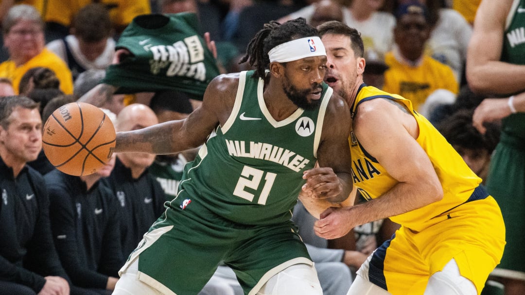 May 2, 2024; Indianapolis, Indiana, USA; Milwaukee Bucks guard Patrick Beverley (21) dribbles the ball while Indiana Pacers guard T.J. McConnell (9) defends during game six of the first round for the 2024 NBA playoffs at Gainbridge Fieldhouse. Mandatory Credit: Trevor Ruszkowski-USA TODAY Sports