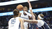 Dec 3, 2024; Dallas, Texas, USA;  Memphis Grizzlies guard Ja Morant (12) shoots as Dallas Mavericks guard Klay Thompson (31) defends  during the second half at American Airlines Center. Mandatory Credit: Kevin Jairaj-Imagn Images