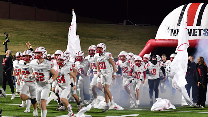 Muenster runs out onto the field during a playoff game against Lindsay on Friday, Dec. 5, 2025 at Memorial Stadium.
