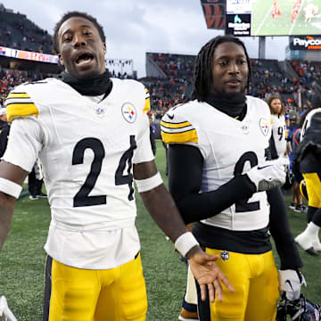 Nov 26, 2023; Cincinnati, Ohio, USA;  Pittsburgh Steelers cornerback Joey Porter Jr. (24) and cornerback Darius Rush (21) celebrate after the game against the Cincinnati Bengals at Paycor Stadium. Mandatory Credit: Joseph Maiorana-Imagn Images