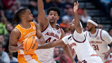 Tennessee guard Chaz Lanier (2) is guarded by Auburn guard Joah Shay (12) and center Dylan Cardwell (44) during the first half of their semifinal game of the SEC Men's Basketball Tournament at Bridgestone Arena in Nashville, Tenn., Saturday, March 15, 2025.