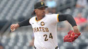Aug 20, 2025; Pittsburgh, Pennsylvania, USA;  Pittsburgh Pirates starting pitcher Johan Oviedo (24) delivers a pitch against the Toronto Blue Jays during the first inning at PNC Park. Mandatory Credit: Charles LeClaire-Imagn Images