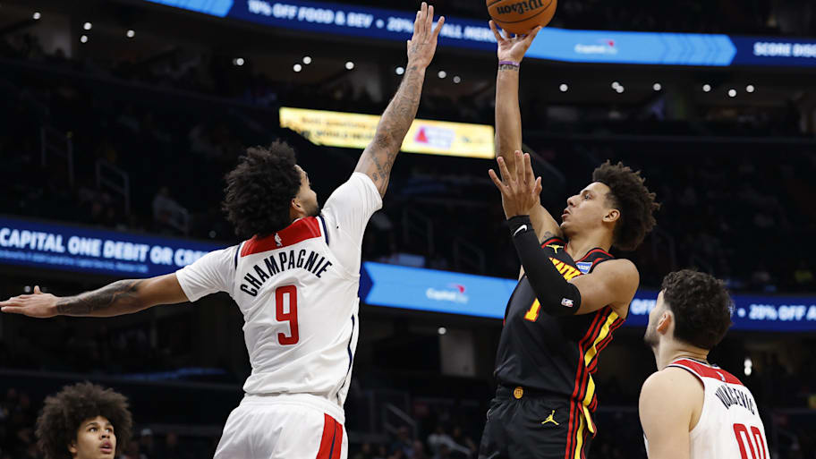 Hawks forward Jalen Johnson shoots the ball over Wizards forward Justin Champagnie.