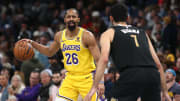 Mar 27, 2024; Memphis, Tennessee, USA; Los Angeles Lakers guard Spencer Dinwiddie (26) dribbles as Memphis Grizzlies forward-center Santi Aldama (7) defends during the first half at FedExForum. Mandatory Credit: Petre Thomas-USA TODAY Sports