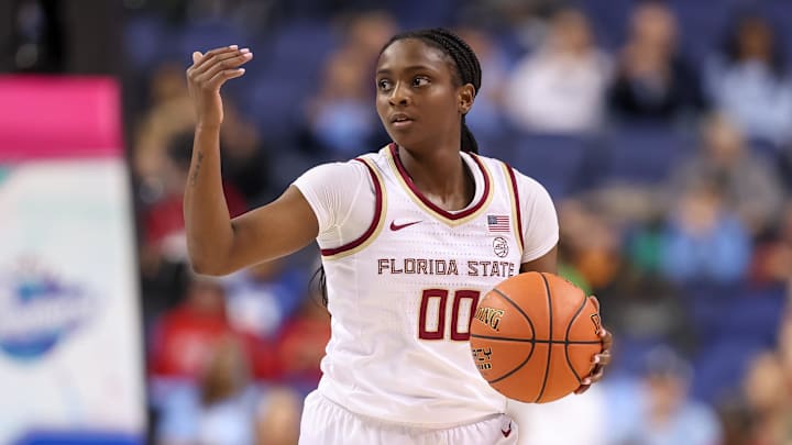 Mar 7, 2025; Greensboro, NC, USA;  Florida State Seminoles guard Ta'Niya Latson (00) sets the play during the third quarter against North Carolina Tar Heels at First Horizon Coliseum. Mandatory Credit: Cory Knowlton-Imagn Images