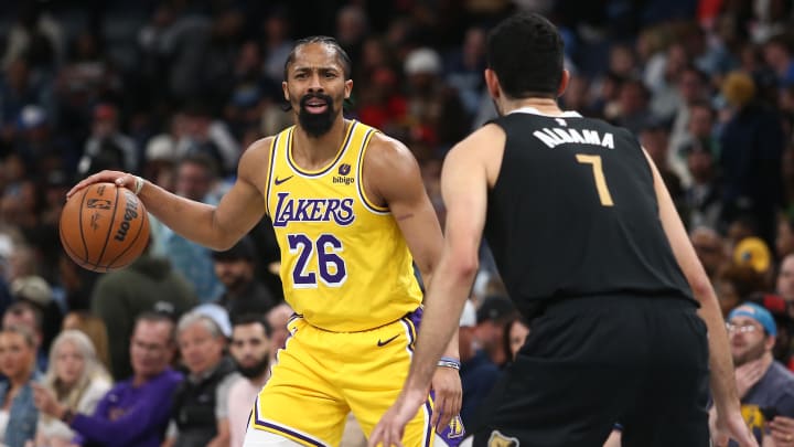 Mar 27, 2024; Memphis, Tennessee, USA; Los Angeles Lakers guard Spencer Dinwiddie (26) dribbles as Memphis Grizzlies forward-center Santi Aldama (7) defends during the first half at FedExForum. Mandatory Credit: Petre Thomas-USA TODAY Sports