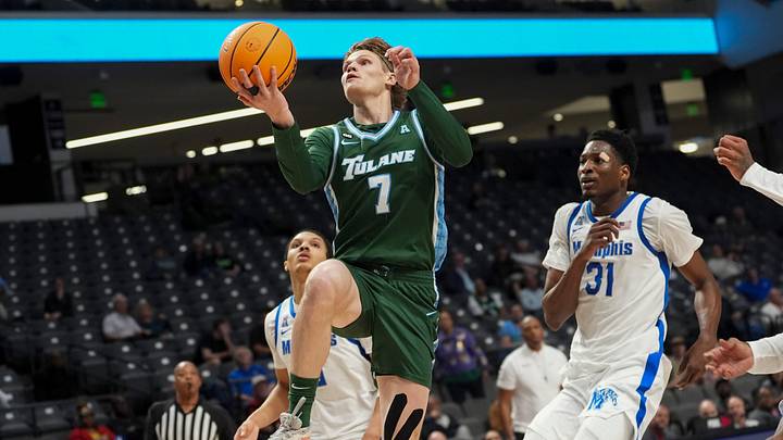 Tulane's Rowan Brumbaugh (7) goes for a layup during the first round American Conference Tournament game between Memphis and Tulane in Birmingham, Ala, on March 11, 2026.