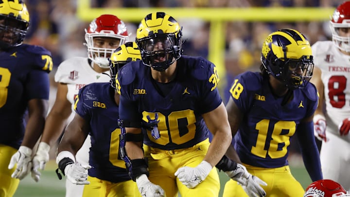 Aug 31, 2024; Ann Arbor, Michigan, USA;  Michigan Wolverines linebacker Jimmy Rolder (30) celebrates a play in the second half against the Fresno State Bulldogs at Michigan Stadium.