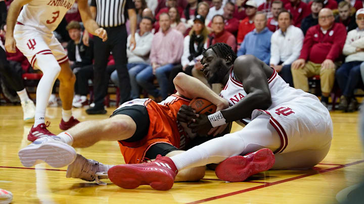Illinois Fighting Illini forward Ben Humrichous (3) and and Indiana Hoosiers center Oumar Ballo (11) battle for a loose ball. during the first half at Simon Skjodt Assembly Hall. Illinois Fighting Illini forward Ben Humrichous (3) and and Indiana Hoosiers center Oumar Ballo (11) battle for a loose ball. during the first half at Simon Skjodt Assembly Hall.