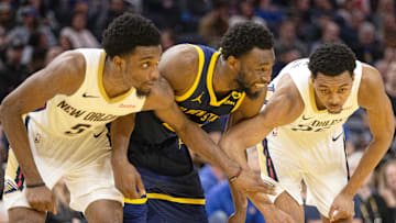 Apr 12, 2024; San Francisco, California, USA; New Orleans Pelicans forwards Herbert Jones (5) and Trey Murphy III (25) await a foul shot with Golden State Warriors forward Andrew Wiggins (22) during the fourth quarter at Chase Center. Mandatory Credit: D. Ross Cameron-Imagn Images