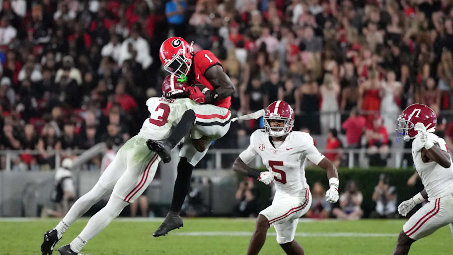 Alabama defensive back Keon Sabb tackles Georgia wide receiver Zachariah Branch.