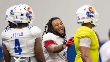 Kansas senior linebacker Joseph Sipp Jr. (3) laughs during Kansas Football Fan Appreciation Day Saturday, April. 5, 2025 at the Kansas Football Indoor Practice Facility in Lawrence, Kan.