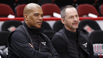 Apr 22, 2022; Chicago, Illinois, USA; Chicago Bulls executive vice president of basketball operations Arturas Karnisovas (right) talks with general manager Marc Eversley (left) before game three of the first round for the 2022 NBA playoffs against the Milwaukee Bucks at United Center. Mandatory Credit: Kamil Krzaczynski-Imagn Images