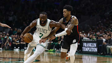 Mar 5, 2025; Boston, Massachusetts, USA; Boston Celtics guard Jaylen Brown (7) drives on Portland Trail Blazers guard Anfernee Simons (1) during the first quarter at TD Garden. Mandatory Credit: Winslow Townson-Imagn Images