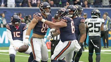 Oct 13, 2024; London, United Kingdom;  Chicago Bears tight end Cole Kmet (85)  celebrates scoring a touchdown with teammates during an NFL International Series game at Tottenham Hotspur Stadium. Mandatory Credit: Peter van den Berg-Imagn Images