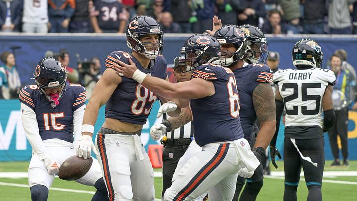 Oct 13, 2024; London, United Kingdom;  Chicago Bears tight end Cole Kmet (85)  celebrates scoring a touchdown with teammates during an NFL International Series game at Tottenham Hotspur Stadium. Mandatory Credit: Peter van den Berg-Imagn Images