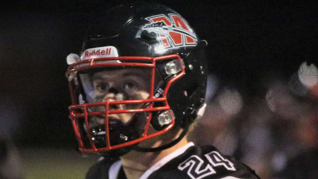 Wisconsin high school football: Muskego High School safety Hunter Wohler looks at the scoreboard. 2025