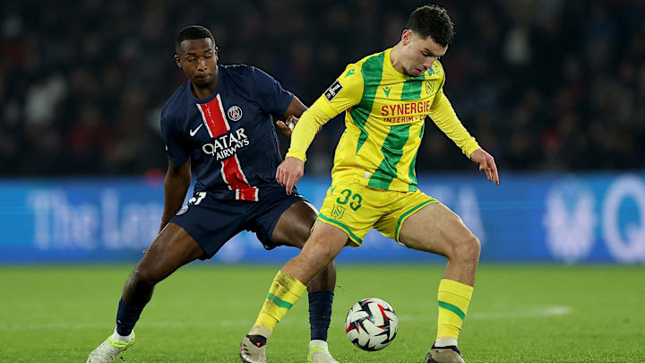 Mathis Abline facing Willian Pacho as PSG shared points with FC Nantes