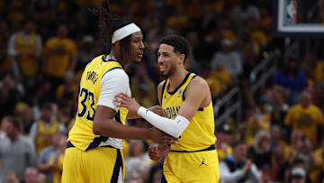May 27, 2025; Indianapolis, Indiana, USA; Indiana Pacers guard Tyrese Haliburton (0) reacts with center Myles Turner (33) after shooting a three point basket during the second quarter against the New York Knicks of game four of the eastern conference finals for the 2025 NBA Playoffs at Gainbridge Fieldhouse. Mandatory Credit: Trevor Ruszkowski-Imagn Images