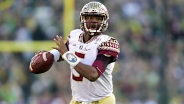 January 1, 2015; Pasadena, CA, USA; Florida State Seminoles quarterback Jameis Winston (5) runs the ball against the Oregon Ducks in the 2015 Rose Bowl college football game at Rose Bowl. Mandatory Credit: Gary A. Vasquez-Imagn Images