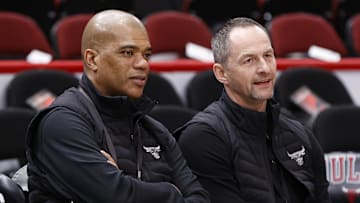 Apr 22, 2022; Chicago, Illinois, USA; Chicago Bulls executive vice president of basketball operations Arturas Karnisovas (right) talks with general manager Marc Eversley (left)